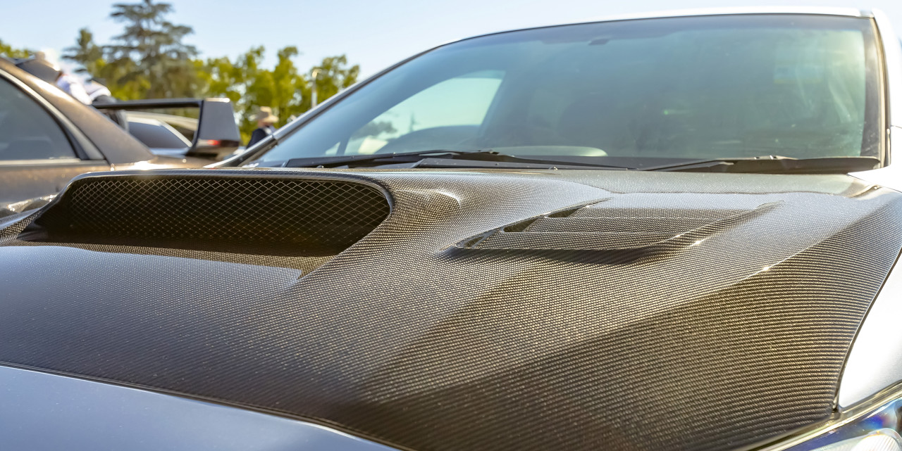 Carbon Fiber Hood on Silver Car