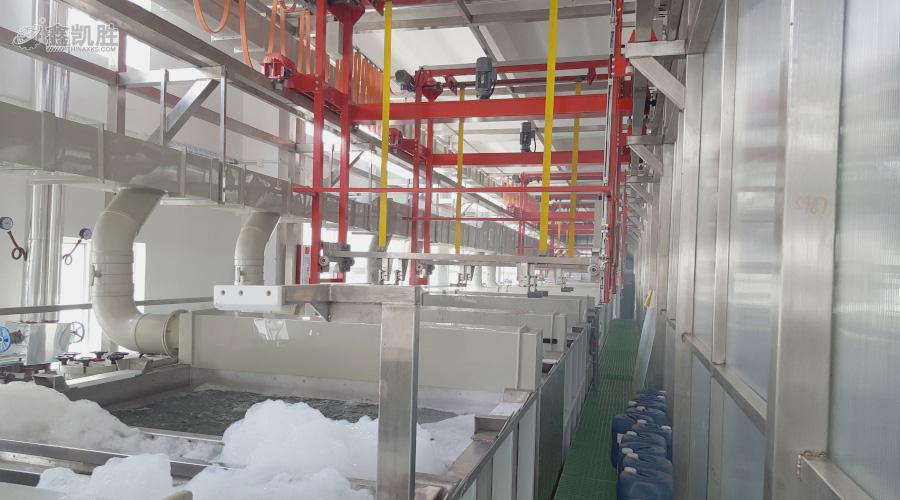 Powder coating booth applying electrostatic coating to drill press stand