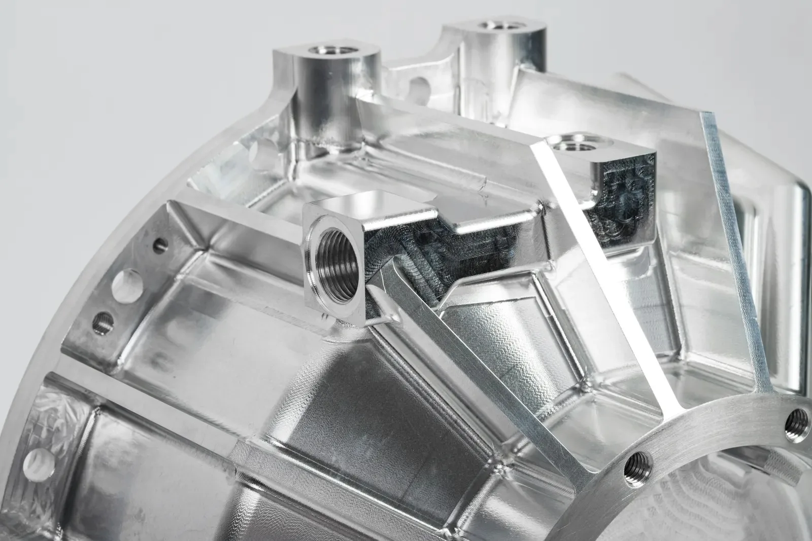 5-axis CNC machining center processing aluminum housing with multi-surface milling