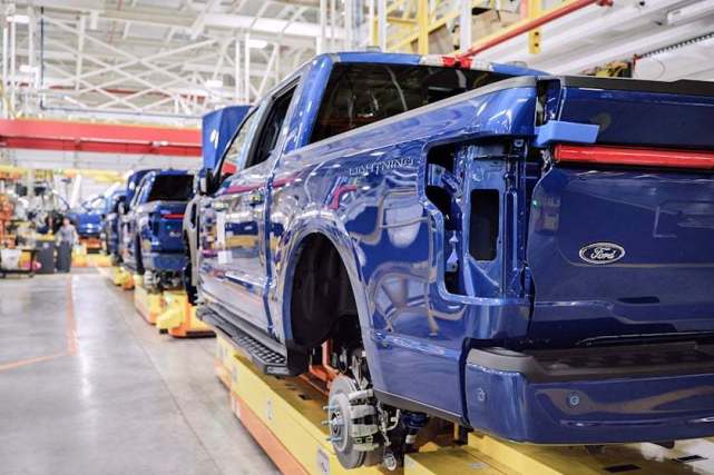 Blue Truck Manufacturing Process in Modern Factory