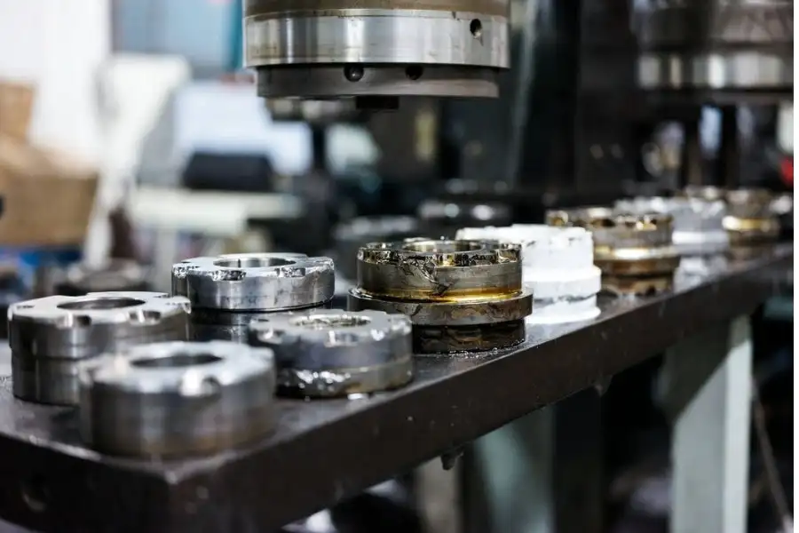 Surface treatment comparison showing passivation plating anodizing and powder coating on stamped metal parts